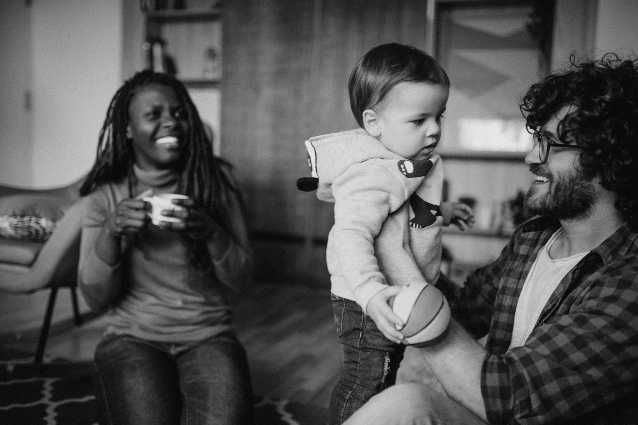 Foster parents playing with baby